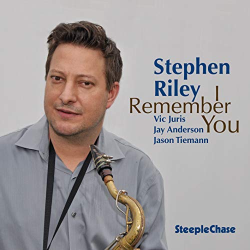 "Album cover featuring a man holding a saxophone, with title and artist name."