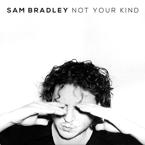 Black and white album cover with a man covering his eyes.