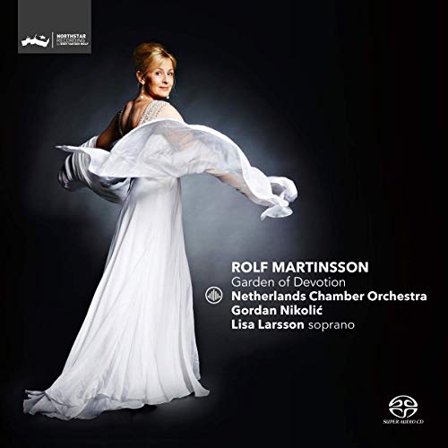"Album cover featuring a woman in a white dress against a dark background."