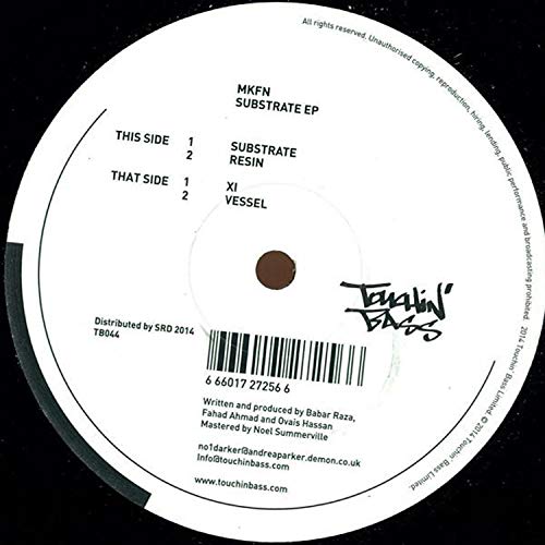 White vinyl record with black text and barcode on a black background.