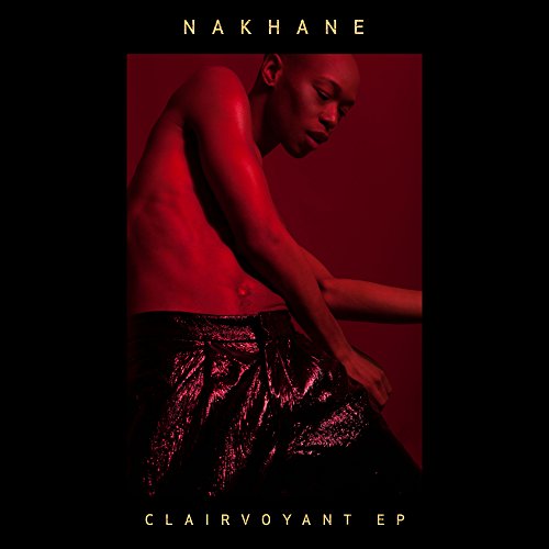 "Album cover with a shirtless man in red-lit pose, against a dark red background."