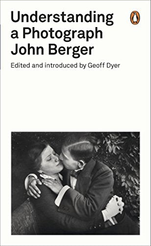 Book cover with black-and-white image of a man and woman embracing, Penguin logo visible.
