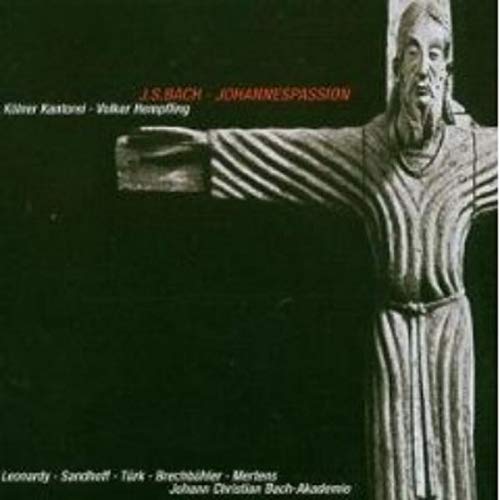 A CD cover featuring a statue of Jesus on the cross against a dark background.