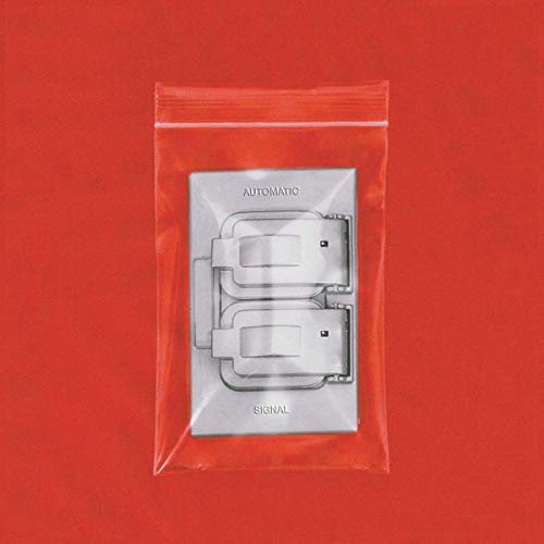 A plastic bag containing a silver CD titled "Automatic - Signal" on a red background.