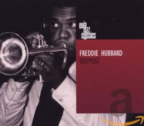 "Album cover with black and white photo of man playing trumpet, red text box."