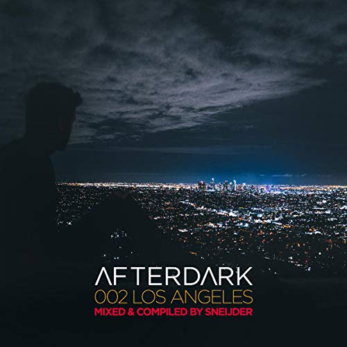 "Album cover with silhouette of a man overlooking a lit cityscape at night."