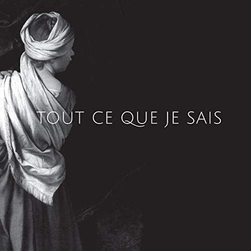 Black and white vinyl album cover featuring a person in a headscarf against a dark background.