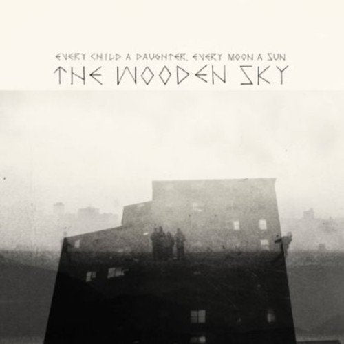 "Album cover with foggy, black-and-white image of building and stylized band name."