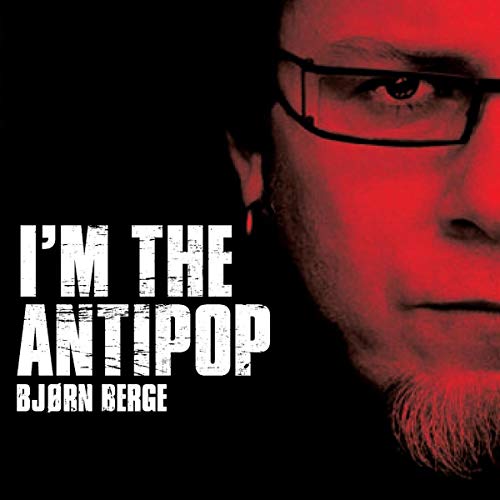 "Album cover featuring a close-up of a man's face with red lighting."