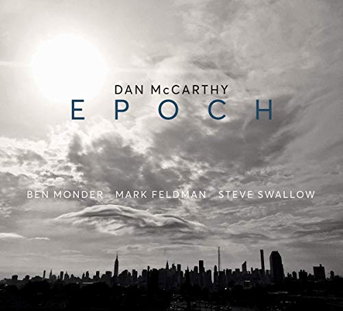 "Album cover with city skyline and cloudy sky, featuring artist and album names."