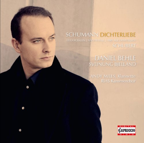 CD album cover featuring a man in a black jacket, beige background.