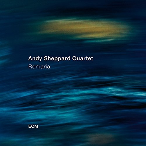 "Album cover with dark blue background, blurry water effect, and white text."
