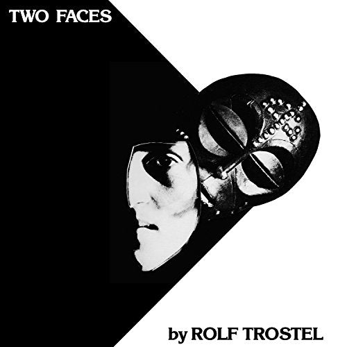 "Black and white album cover with a woman's face and a metal mask."