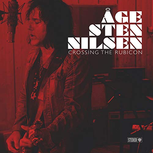 "Album cover with Åge Sten Nilsen holding a guitar, red-tinted studio background."