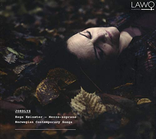 "CD cover featuring a woman lying on the ground surrounded by autumn leaves."