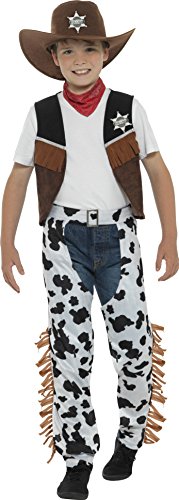 A young boy wearing a cowboy costume, including a hat, vest, and cow-print pants.
