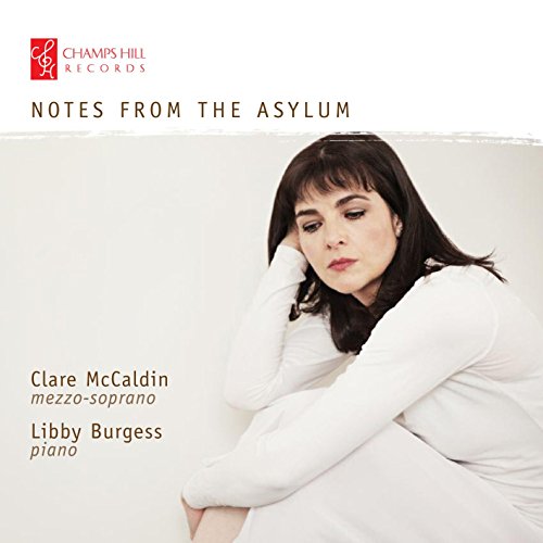 A woman with dark hair and a white shirt on a white background album cover.
