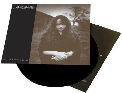 Vinyl record with black sleeve and sepia-toned cover featuring a woman outdoors.