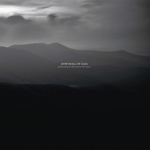 "Black and white album cover with misty mountains and cloudy sky, text 'Downfall of Gaia'."