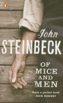 "Book cover of 'Of Mice and Men' showing two hands clasped together on a wooden surface."