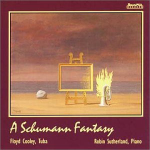 "A CD cover featuring a surreal beach scene with easel, flame, and rock."