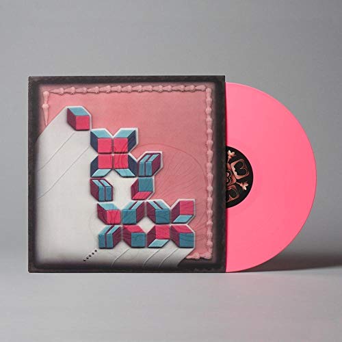 Pink vinyl record with pink and blue 3D cover art, partially visible sleeve.