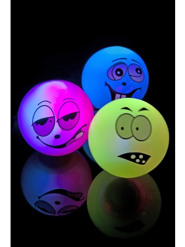 Three glowing balls with cartoon faces are stacked together against a dark background.