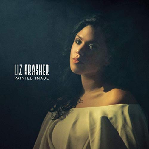 "Album cover featuring a woman in a white dress against a dark background."