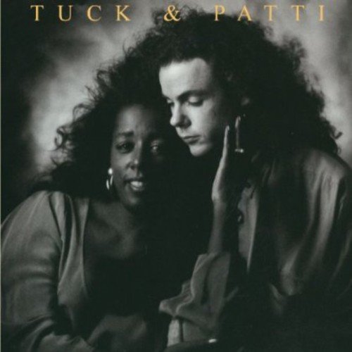 "Black and white album cover with man and woman, gold text 'TUCK & PATTI'."