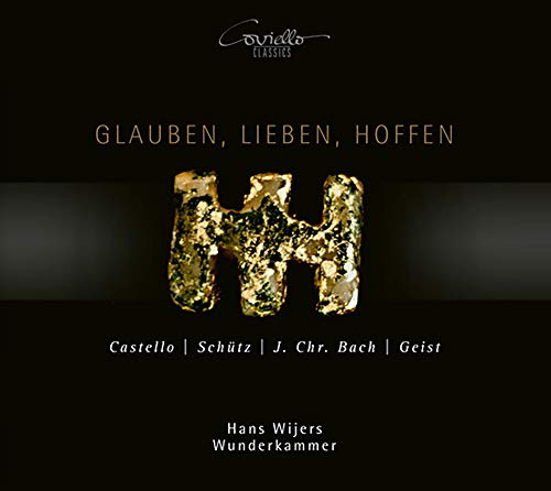 A black album cover with gold lettering and a textured gold "W" in the center.