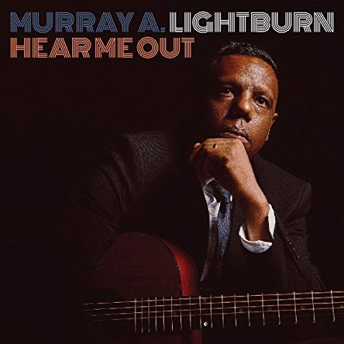 "Album cover featuring a man in a suit holding a guitar, with artist and album name."