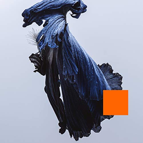 The image depicts a dark blue, abstract, twisted sculpture against a light grey background. A small orange square is overlaid on the bottom right. Alt text: "Dark blue abstract sculpture with twisted, flowing shape, orange square overlay."
