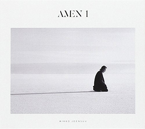 The alt text for the image is: "Album cover with a man kneeling on a flat surface."