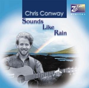 "Album cover featuring a man playing guitar with a rainbow in the background."