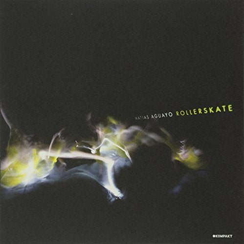 "Black album cover with blurred figure and text 'Matias Aguayo Rollerskate' in yellow."