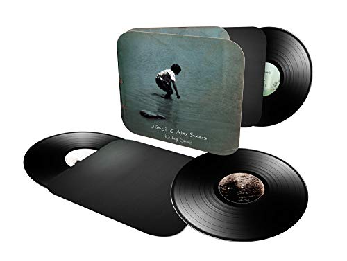 Vinyl record set with album cover featuring a person crouching on a beach.