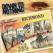"Album cover with 'Richmond' postcard image and 'Down to Nothing' band name on wooden surface."