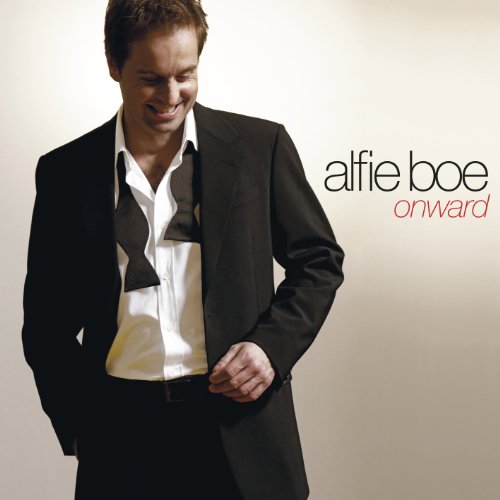 Album cover featuring a man in a black suit and white shirt.