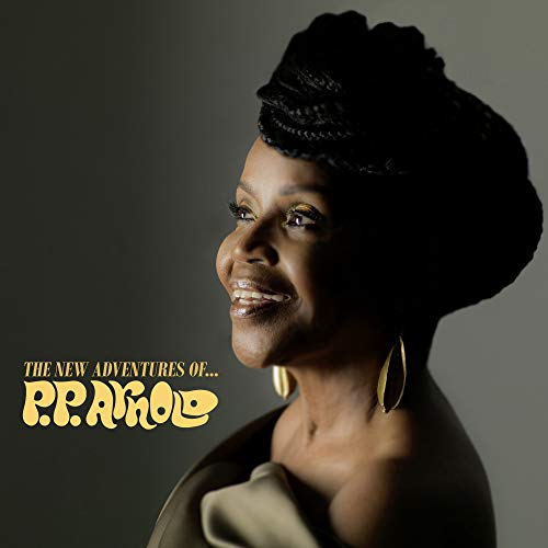 Vinyl album cover featuring a smiling woman with braided hair and gold earrings.
