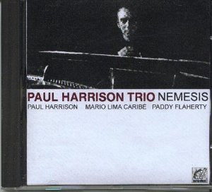 CD case with black and white cover featuring a man at a piano.