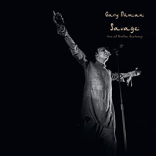 Black and white album cover featuring Gary Numan singing into a microphone.