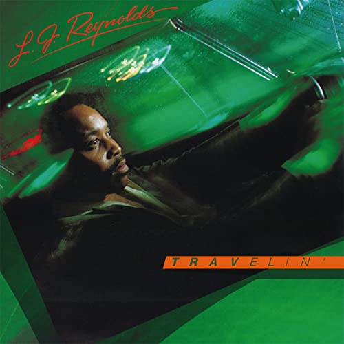 Album cover for L.J. Reynolds’ “Travelin’” featuring a man looking out a car window.