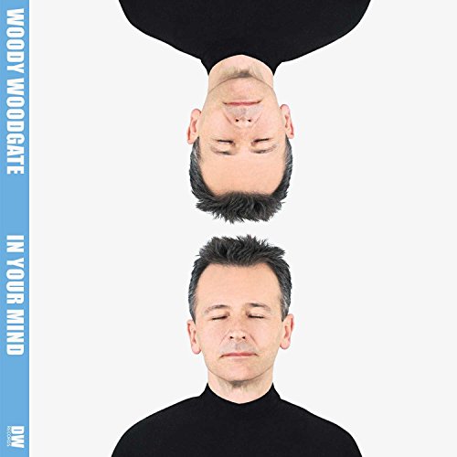 The alt text is: "CD cover with man upside down and right side up."