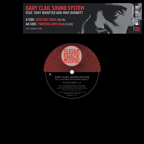 Vinyl record with red and white label on a black background.