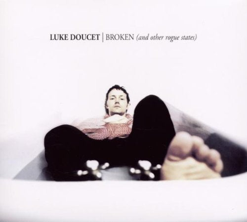 Album cover featuring a man lying on his back in a bathtub.
