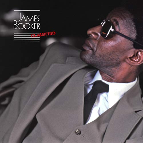 Album cover featuring a man in a gray suit, white shirt, and black tie.