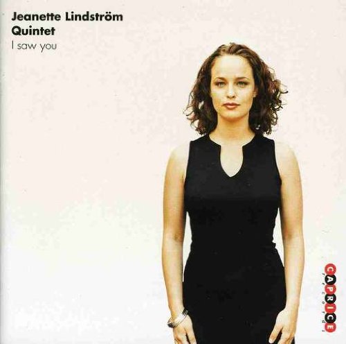 CD album cover featuring a woman in a black dress against a white background.