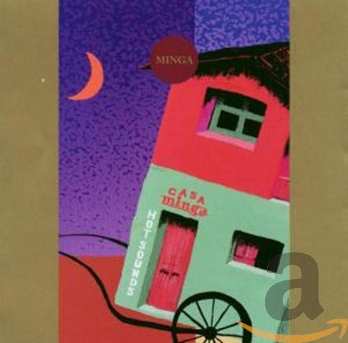 "Album cover featuring a colorful, two-story house on wheels under a purple sky."