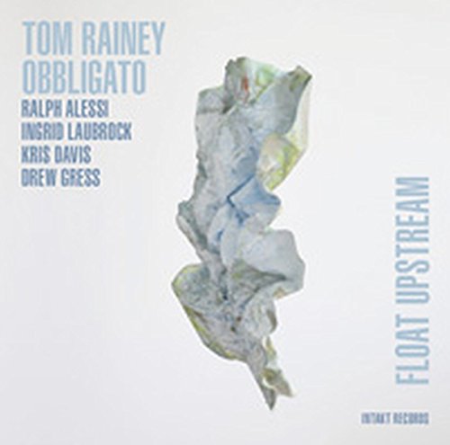 Album cover with crumpled paper in center, artist names, and title "Float Upstream".