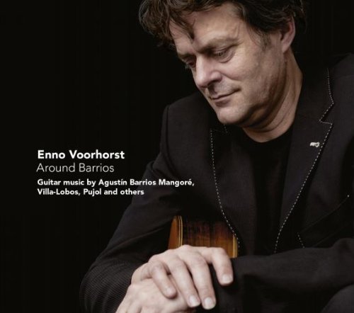 CD cover with a man holding a guitar against a black background.